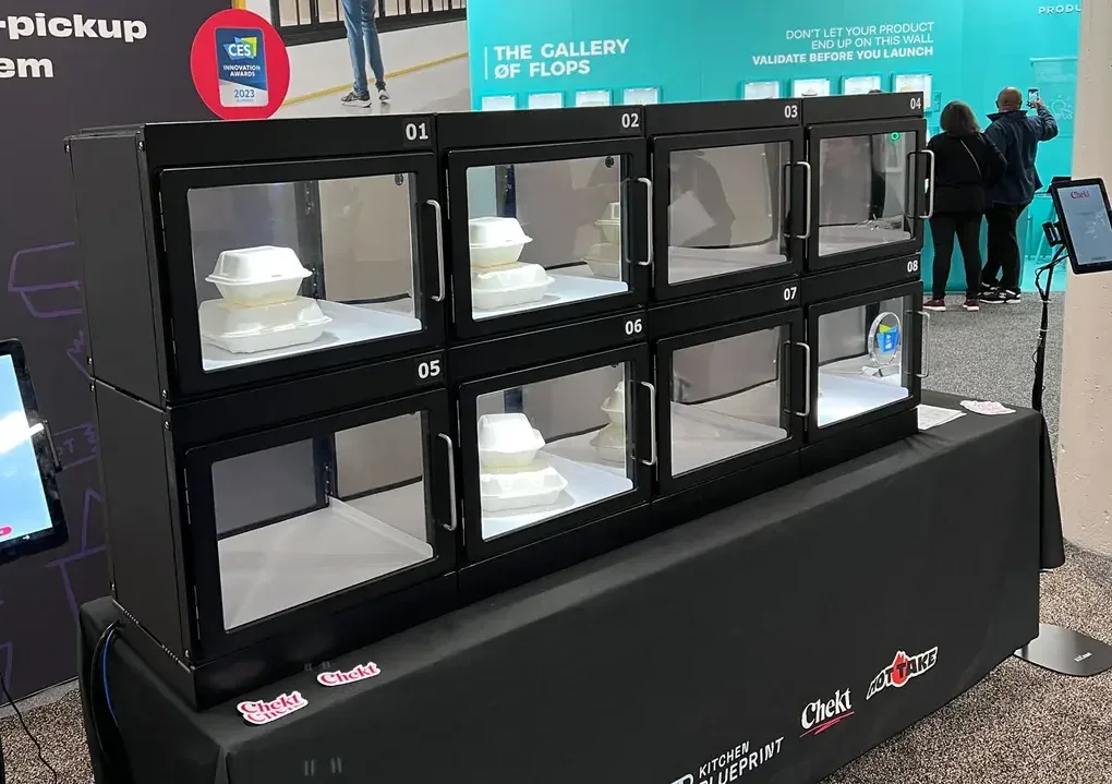 Chekt contactless food-pickup smart lockers on display at CES, holding hot meals behind glass doors